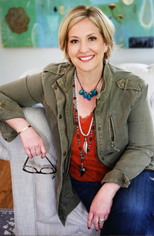 Brene Brown sitting on couch